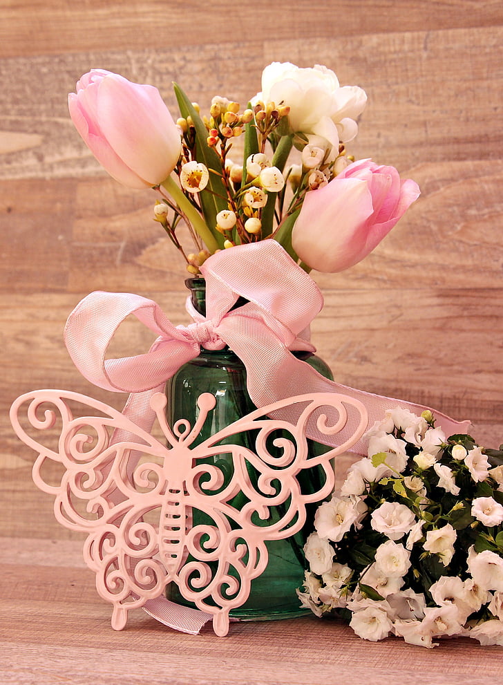 pink tulips with lace decor on tabl