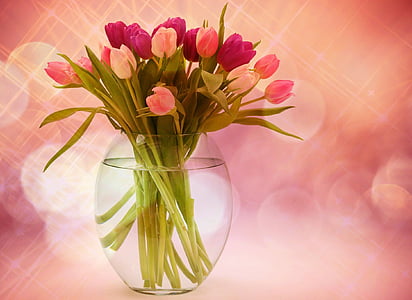bouquet of pink flowers in clear glass vase