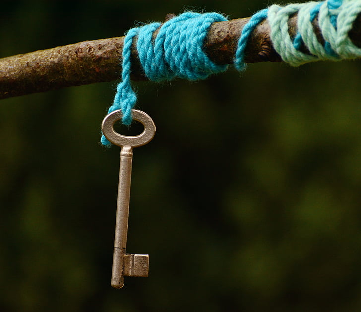 gray key and blue rope