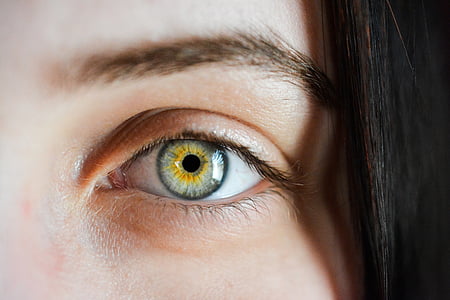 portrait photography of woman's yellow and gray eye