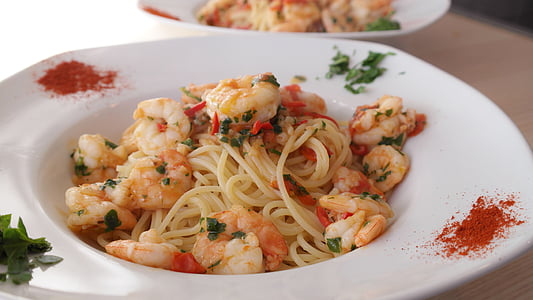 spaghetti with shrimp served on plate