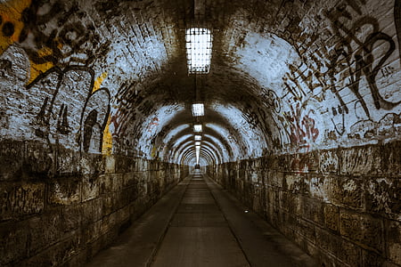 gray and brown concrete tunnel