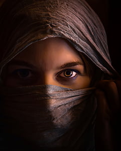 woman wearing brown hijab head dress