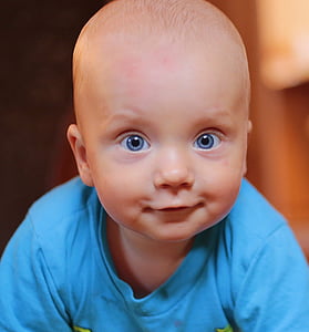 baby wearing blue crew-neck top
