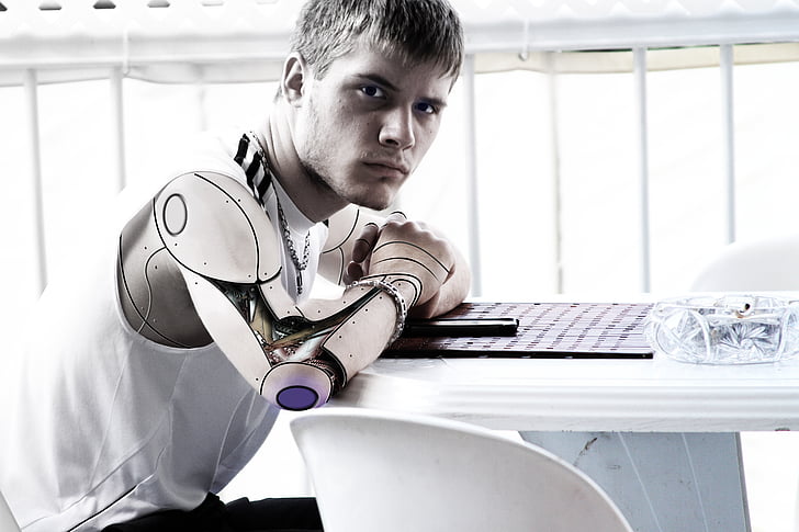 man with robotic arm photo