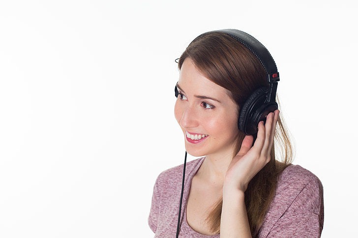 smiling woman with headphones on