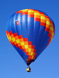 blue, red, and orange hot air balloon