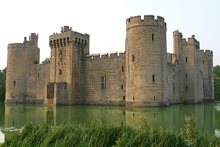 stone castle with water during daytime