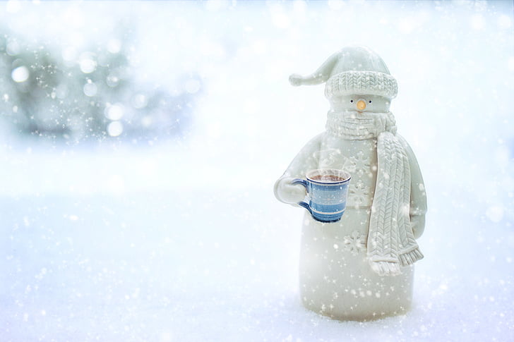 snowman holding mug of coffee