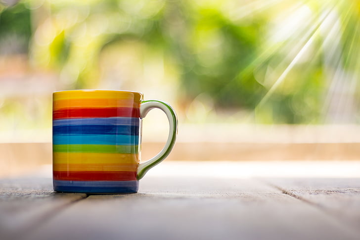 white and multicolored rainbow print ceramic mug