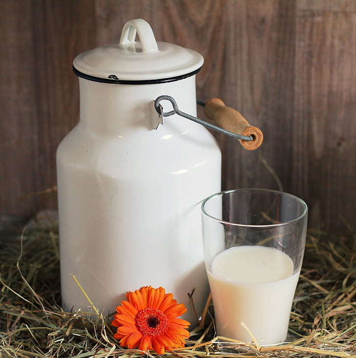 white milk can and drinking glass