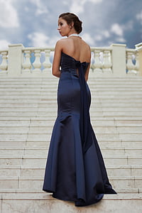 woman wearing strapless dress standing on stairs