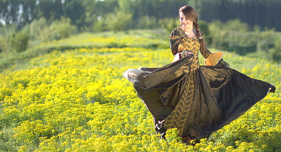 girl wearing black and yellow long-sleeved dress during daytime