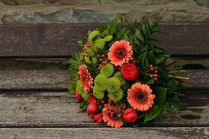 red and green petaled flower bouquet