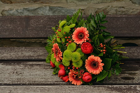 red and green petaled flower bouquet
