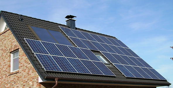blue solar panel on top of roof