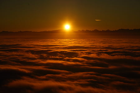 yellow sun on sea of clouds