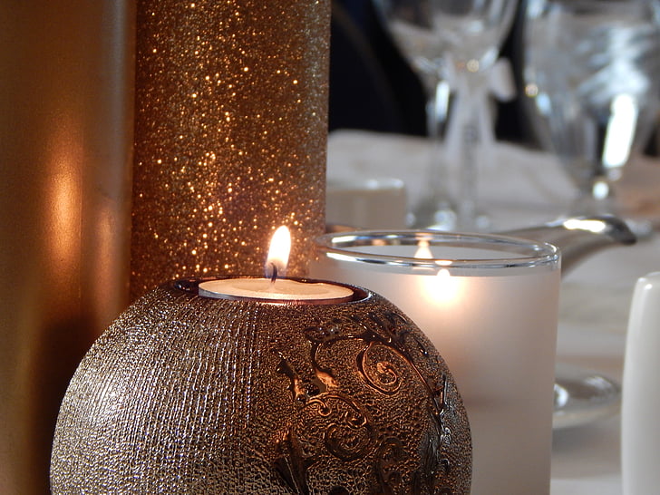 closeup photo of two lit candles