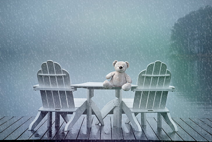 white bear plush toy on white wooden table