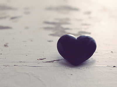 heart-shape black bead on white board