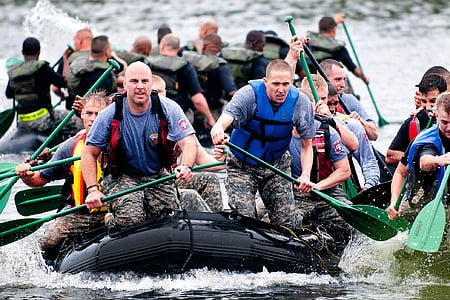 group of men on black inflatable watercraft