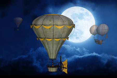 three grey hot air balloons floating during nighttime