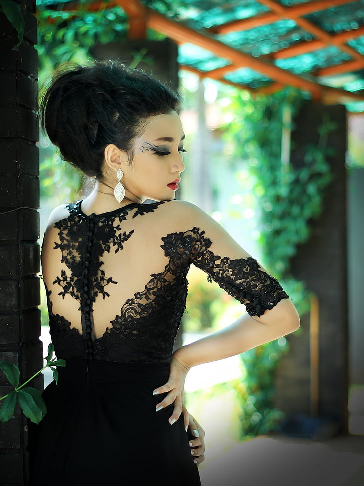 woman in black long-sleeved gown