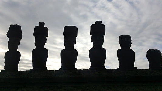 silhouette of six statues