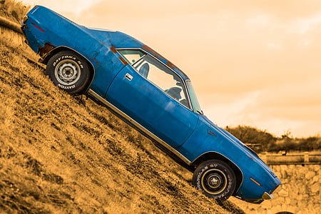 selective photo of blue muscle car during daytime
