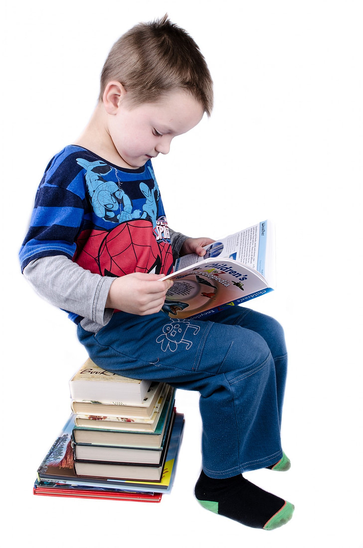 boy sitting reading book