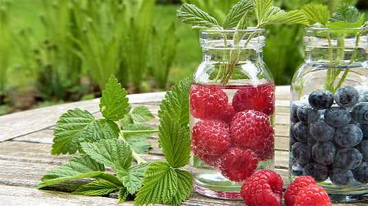 strawberry on mason jar filled with water